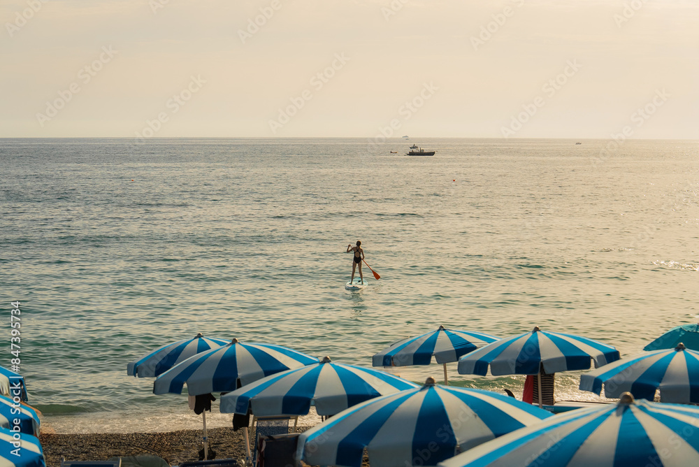 Beach with blue umbrellas on Mediterranean coast Beach with blue umbrellas on Mediterranean coast