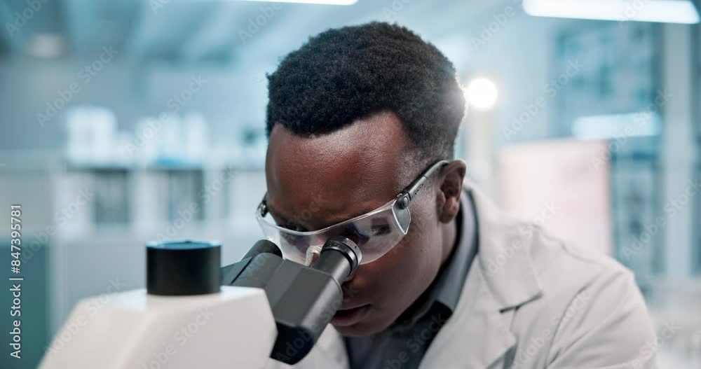 Scientist, black man and microscope or analysis in laboratory for results on medical research and experiment. Innovation, professional and expert with goggles for science development and study review Scientist, black man and microscope or analysis in laboratory for results on medical research and experiment. Innovation, professional and expert with goggles for science development and study review