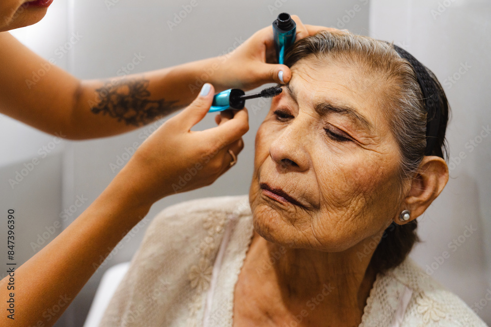 Granddaughter Applying Grandmother's Mascara Granddaughter Applying Grandmother's Mascara