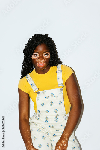 Woman looking at camera posing in studio