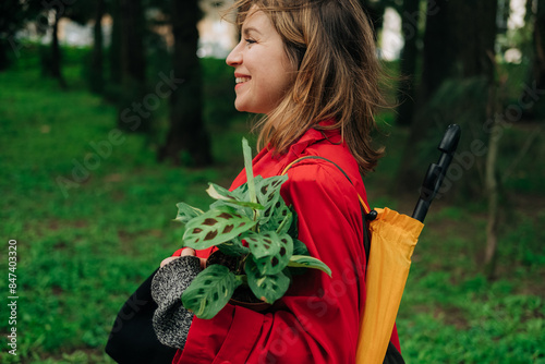 Woman walking with a plant