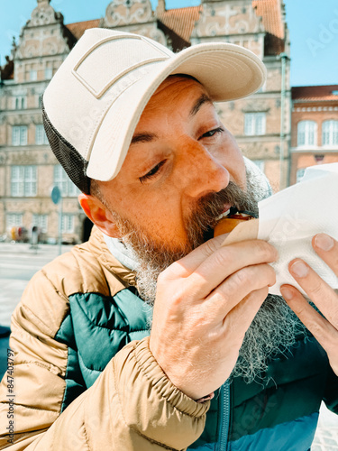 eating some typical hot dogs in Denmark photo