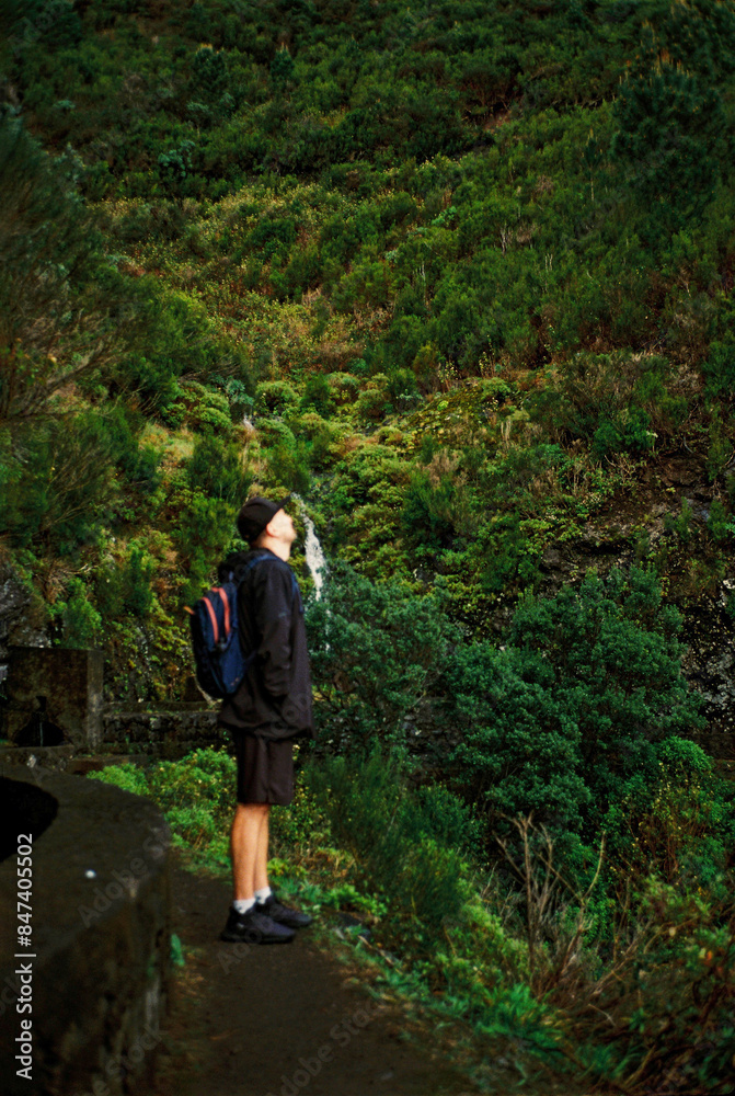 A man looking up in the mountains A man looking up in the mountains