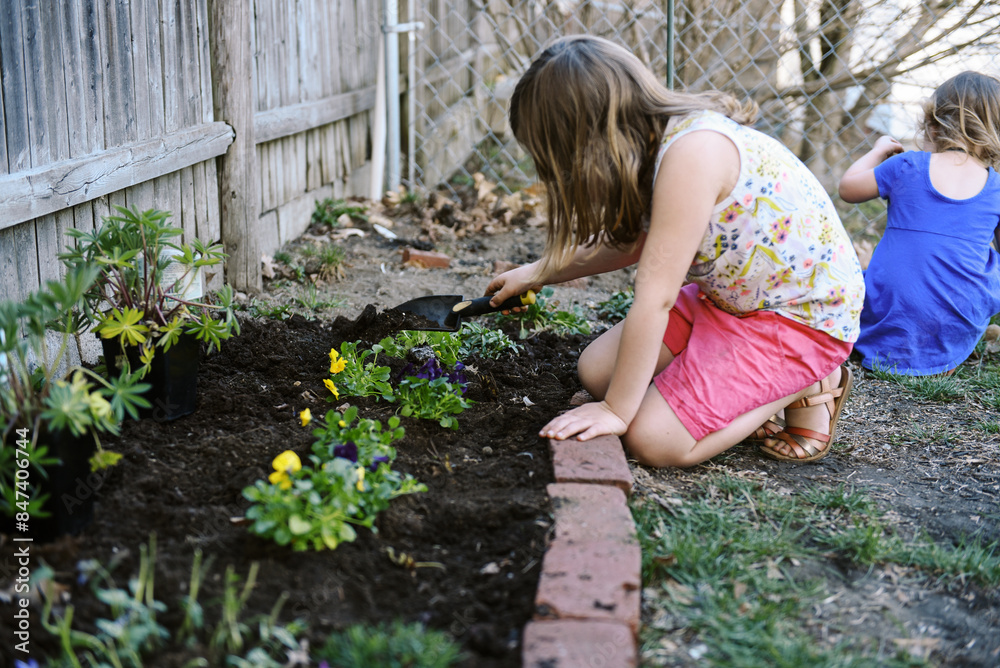 family gardening together in yard in spring family gardening together in yard in spring