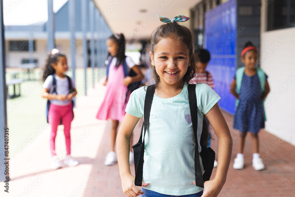 Obraz premium Students with backpacks standing together, smiling and ready for school