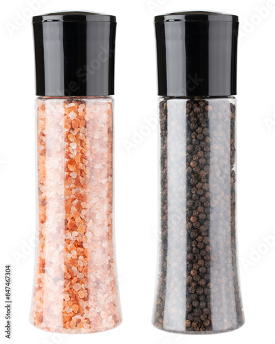 Black pepper and pink Himalayan salt grinder. Glass bottle. Plastic bottle. For home kitchen and restaurant. Natural mineral salt. Culinary equipment. Isolated background. Fresh spice for cooking.