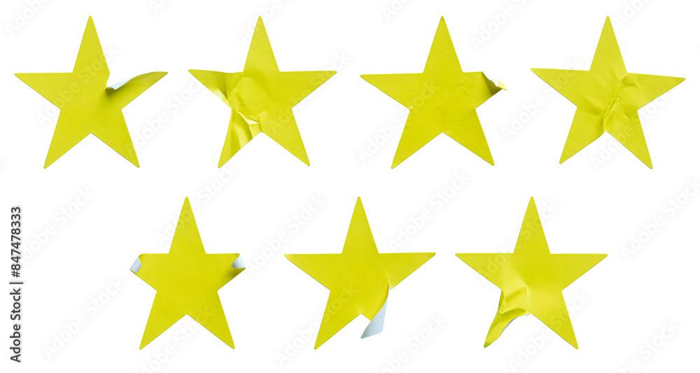A set of yellow star shape paper sticker label isolated on white background. A set of yellow star shape paper sticker label isolated on white background.