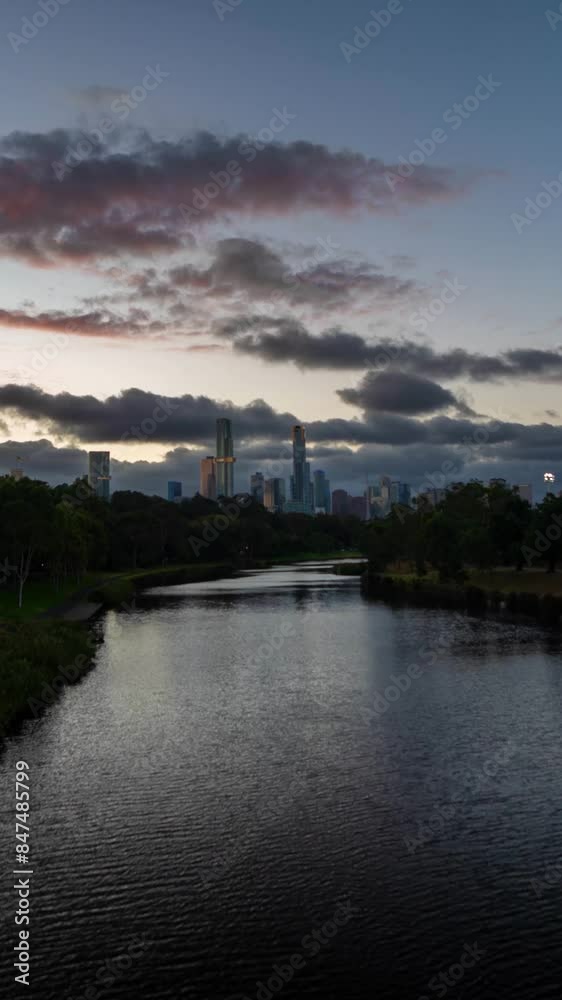 Vertical 4k Timelapse, Sunset Above Melbourne Australia, Botanical Garden Lake and Downtown Buildings Vertical 4k Timelapse, Sunset Above Melbourne Australia, Botanical Garden Lake and Downtown Buildings