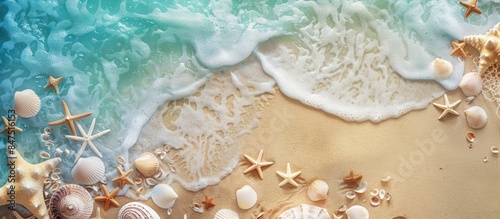 Aerial view of sandy beach adorned with seashells and starfish, embodying a summer backdrop theme with a touch of vintage style.
