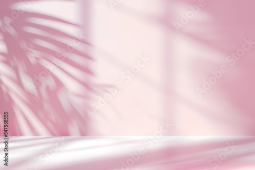 Modern minimalistic light pink background with blurred palm leaves shadow and white floor for product presentation