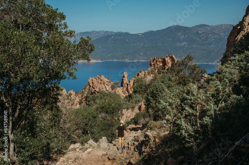 Photography Boy hiking in Corsica's rugged mountains overlooking the sea
