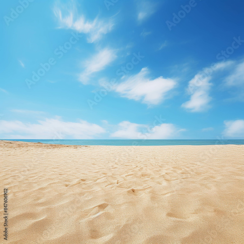 Serene Beachfront Under a Clear Blue Sky with Soft Sand Dunes and Gentle Waves © Gun