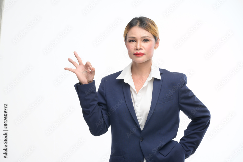 In a studio with a white backdrop, a poised transgender woman dons a tailored suit, striking confident poses, capturing the essence of professionalism and sophistication in various business settings. In a studio with a white backdrop, a poised transgender woman dons a tailored suit, striking confident poses, capturing the essence of professionalism and sophistication in various business settings.