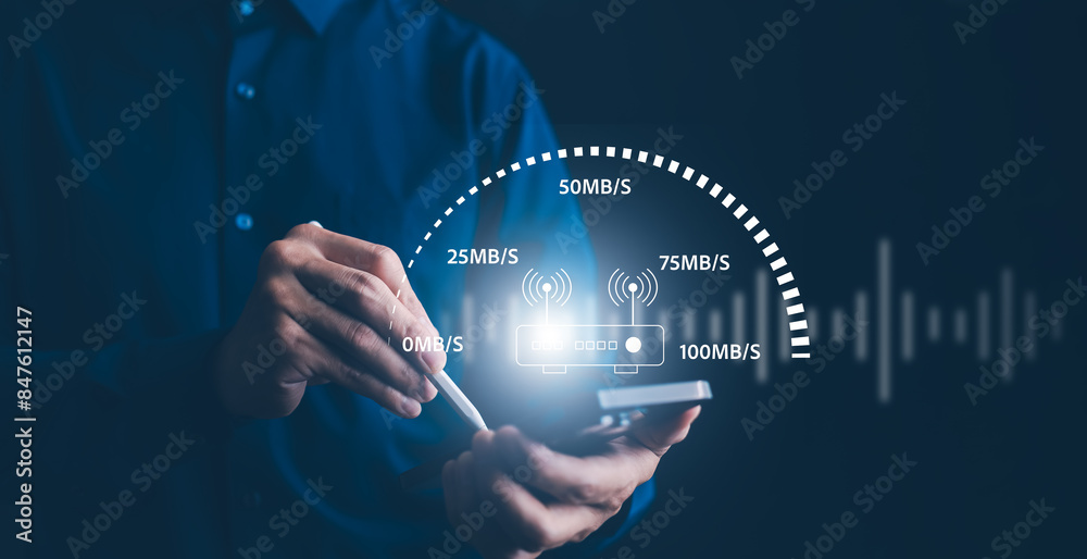 © Bussarin - Fast internet connection with Metaverse technology concept, Hand holding smartphone and Virtual screen of Internet speed measurement,Internet and technology concept, 5G Hi speed internet concept