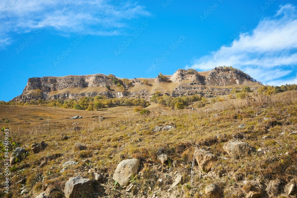 A natural mountain landscape. High peaks of the Caucasus Mountain Range A natural mountain landscape. High peaks of the Caucasus Mountain Range