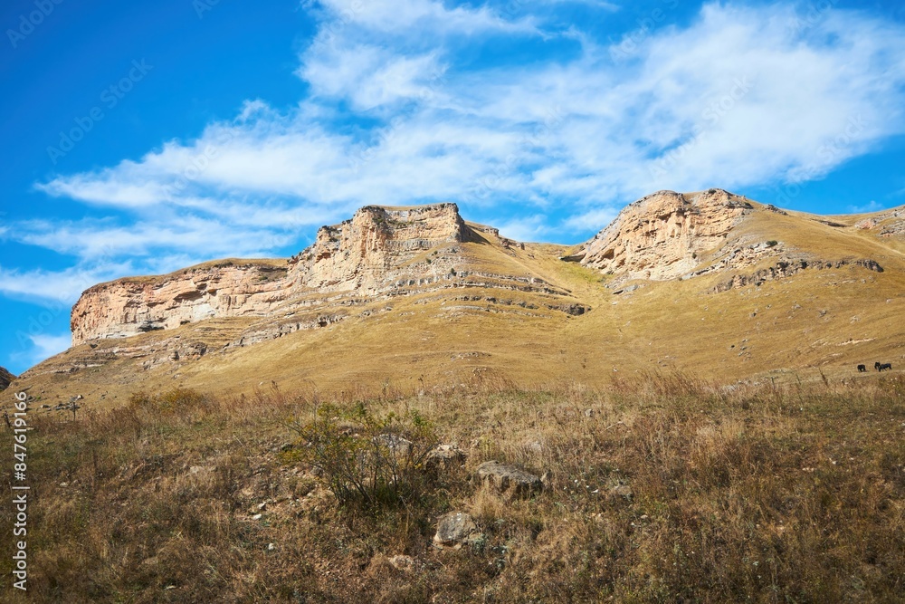 A natural mountain landscape. High peaks of the Caucasus Mountain Range A natural mountain landscape. High peaks of the Caucasus Mountain Range