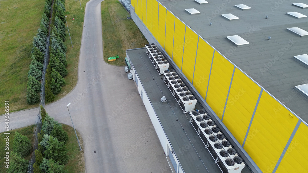 Fototapeta premium Aerial View of HVAC Units on Yellow Commercial Building