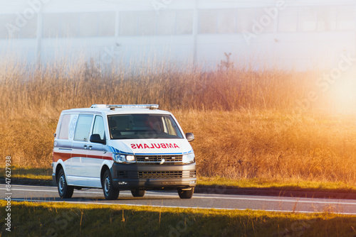 Obraz na plátně Paramedics provide urgent care in speeding ambulance