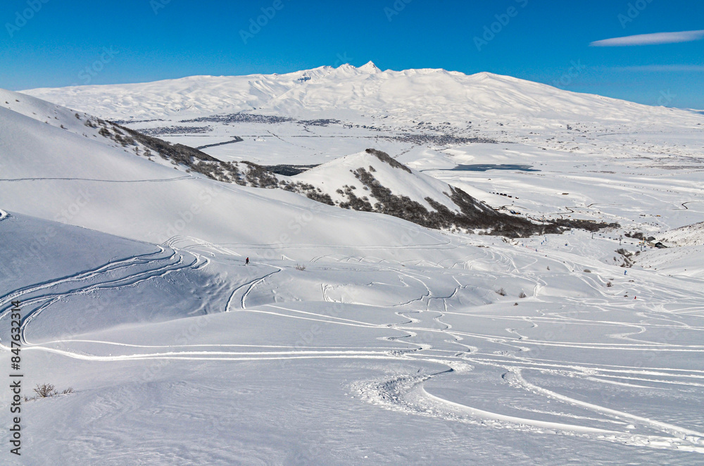 ski tracks on the snowy slopes of Myler Mountain Resort (Yeghipatrush, Armenia) ski tracks on the snowy slopes of Myler Mountain Resort (Yeghipatrush, Armenia)