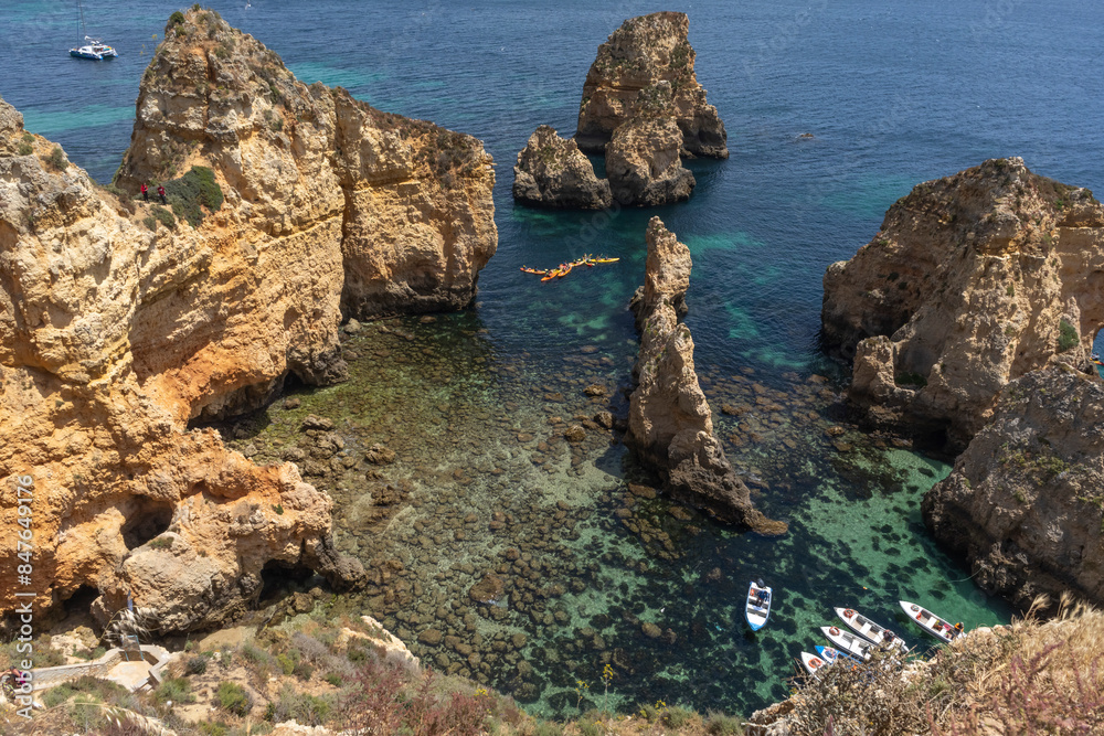 Boats in Lagos Grotto, Algarve, Portugal Boats in Lagos Grotto, Algarve, Portugal