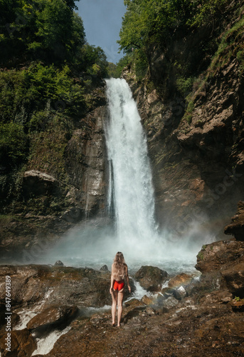 Girl In Red Swimsuit In Front Of Ninoskhevi Waterfall photo