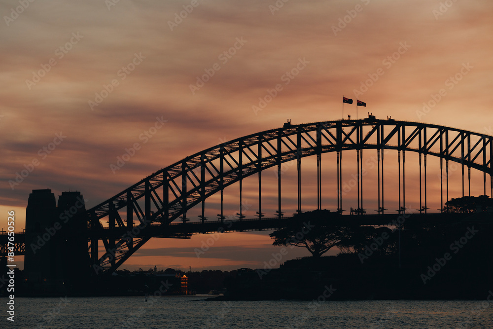Silhouette view of harbor bridge in Sidney at sunset Silhouette view of harbor bridge in Sidney at sunset