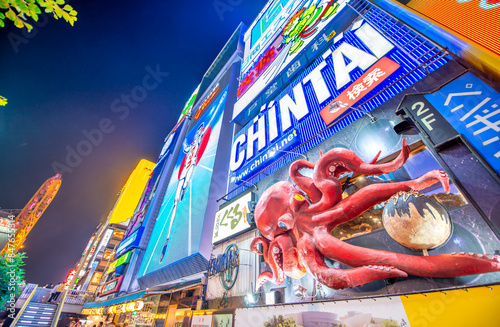 Obraz na płótnie Osaka, Japan - May 28, 2016: Colourful illuminated buildings in Dotonbori at night w salonie