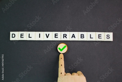 letters of the alphabet with the word Deliverables. Deliverables in project management refer to the quantifiable goods photo