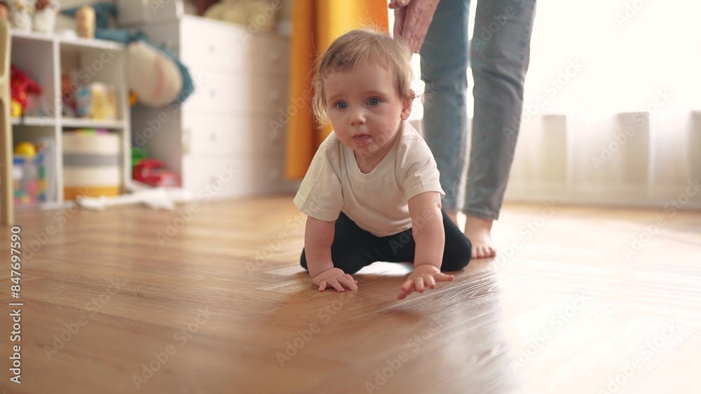 baby crawls. happy family a kid dream concept. baby crawls takes first steps to study indoors. mother teaches baby to crawl takes first steps. lifestyle children learning concept baby crawls. happy family a kid dream concept. baby crawls takes first steps to study indoors. mother teaches baby to crawl takes first steps. lifestyle children learning concept