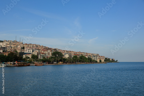 Blue seascape overlooking the coast. View of the Bosphorus in Istanbul city on sunny summer day, in a public place.