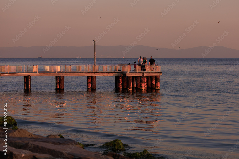Fototapeta premium Evening sea view off the coast of Istanbul. Orange sunset sky 