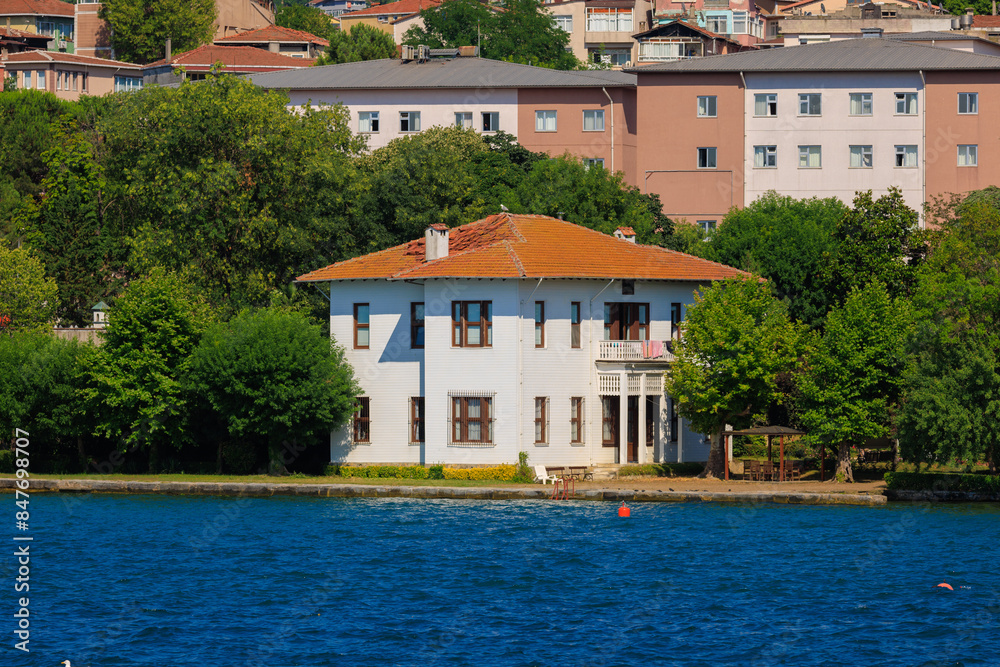 Obraz premium Blue seascape overlooking the coast. View of the Bosphorus in Istanbul city on sunny summer day, in a public place.