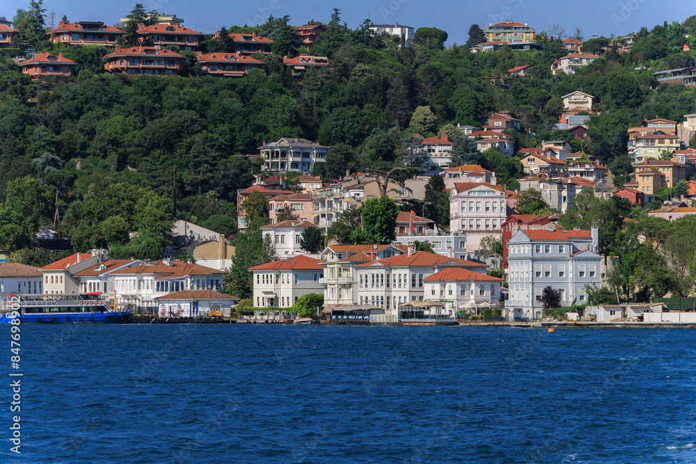 Obraz premium Blue seascape overlooking the coast. View of the Bosphorus in Istanbul city on sunny summer day, in a public place.