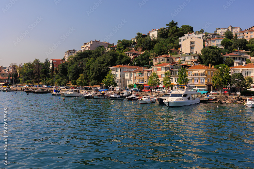 Fototapeta premium Blue seascape overlooking the coast. View of the Bosphorus in Istanbul city on sunny summer day, in a public place.