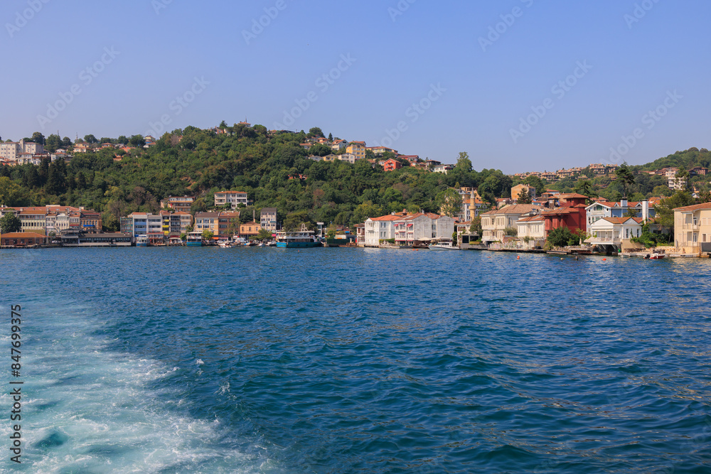 Blue seascape overlooking the coast. View of the Bosphorus in Istanbul city on sunny summer day, in a public place.