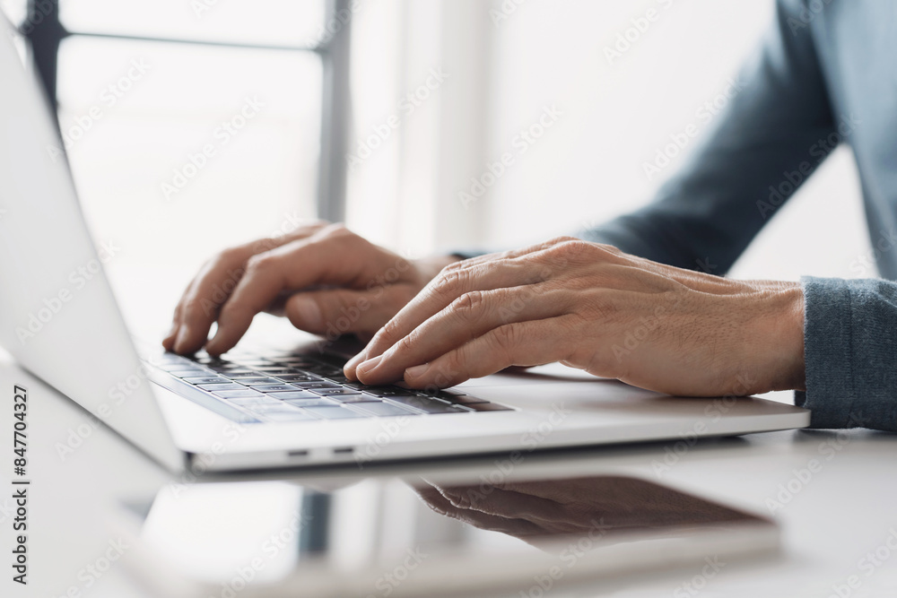Man hands typing on computer keyboard closeup, businessman or student using laptop at home, online learning, internet marketing, working from home, office workplace freelance concept Man hands typing on computer keyboard closeup, businessman or student using laptop at home, online learning, internet marketing, working from home, office workplace freelance concept