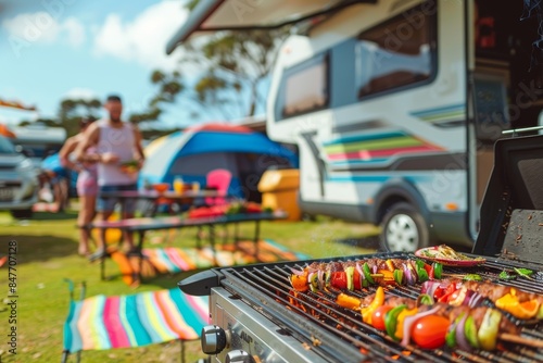 A close-up of a family preparing a delicious outdoor barbecue next to their motorhome, with colorful chairs and tables set up