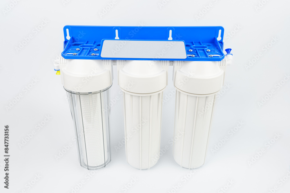 Set three of cartridges for water filter with clear glass of water ...