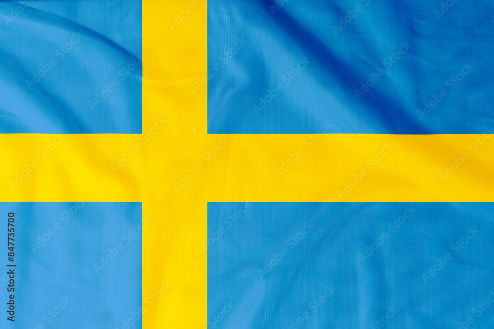 Flag of Kingdom of Sweden with natural material creases as a background