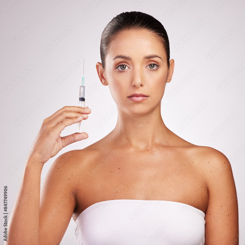 Skincare, woman and portrait in studio with syringe for facelift, cosmetology or treatment on white background. Dermal filler, needle and hand of model for anti aging, plastic surgery or injection Skincare, woman and portrait in studio with syringe for facelift, cosmetology or treatment on white background. Dermal filler, needle and hand of model for anti aging, plastic surgery or injection