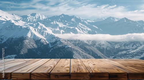 Snow capped peaks piercing the azure sky background