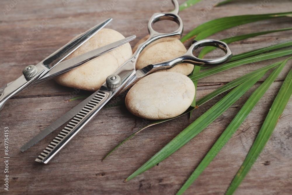 Hair cutting shears on wood background Hair cutting shears on wood background