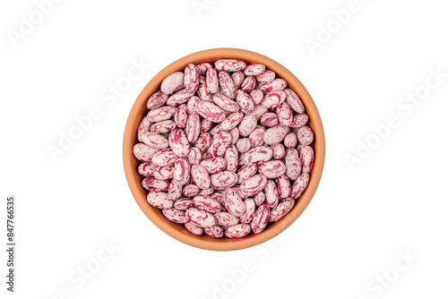 Young, raw Cranberry or pinto beans in a ceramic bowl. isolated on white background. flat lay