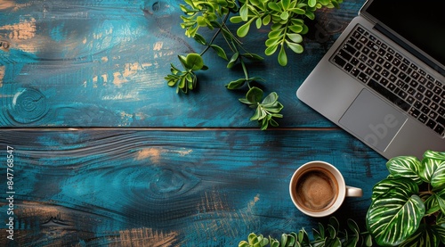 Laptop, Coffee, and Greenery on a Wooden Tabletop