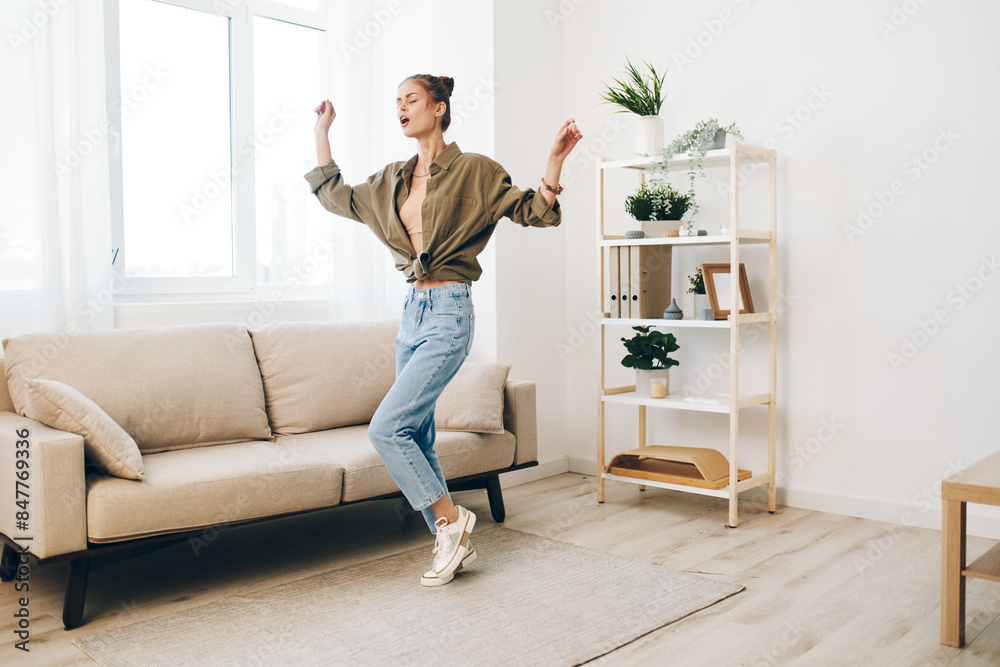 Jumping for Joy: A Happy Woman Dancing and Singing in her Carefree Home