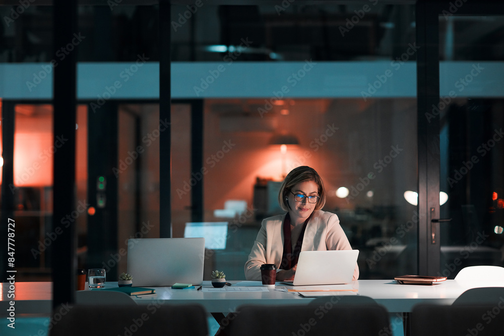 © peopleimages.com - Laptop, business woman and night on social media for company, research and copywriter smile. Happy journalist, typing at desk and reading email, deadline and proofreading for agency article