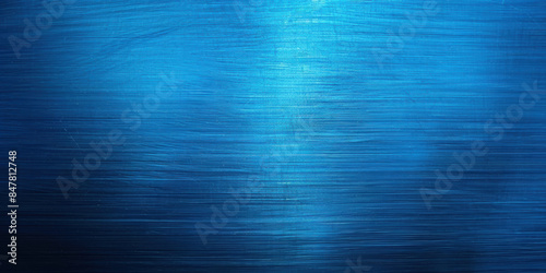 Vibrant blue metallic texture with horizontal brush strokes. Brushed steel plate surface background