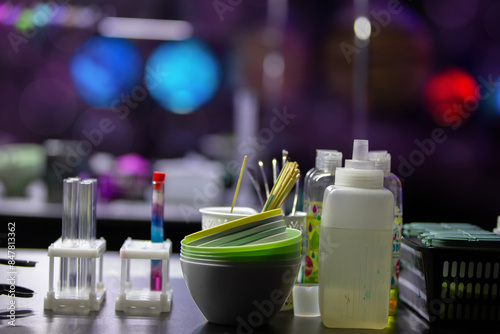 Laboratory table with a variety of chemicals and equipment