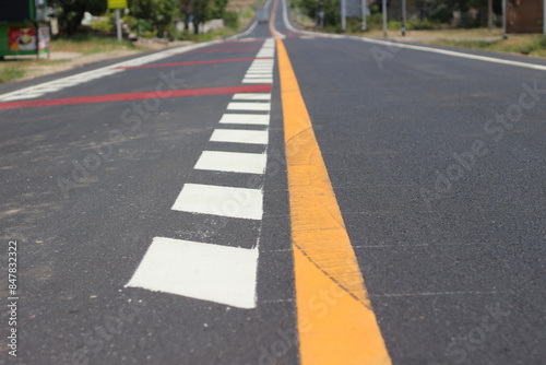 road with yellow line with crosswalk