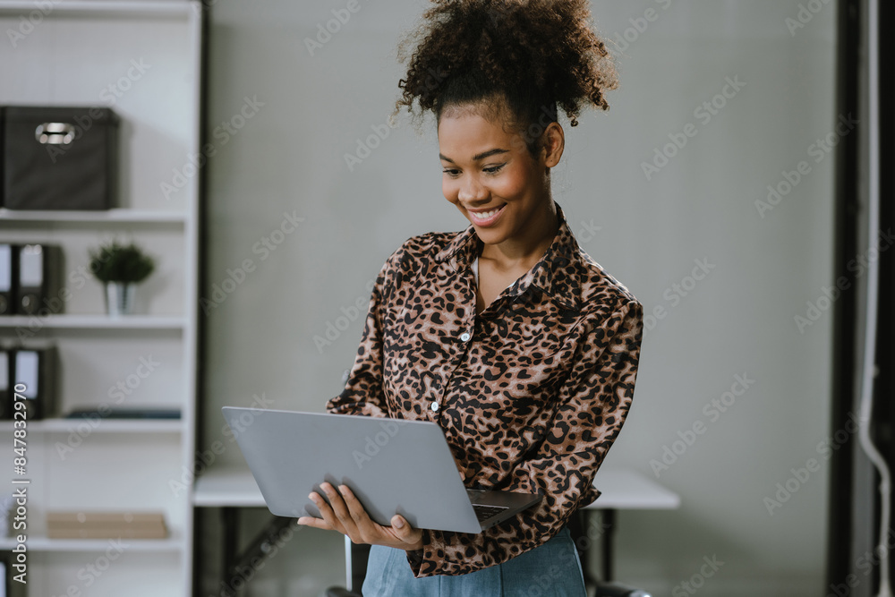 Businesswomen hand working with tablet and laptop computer with documents on office desk in modern office. Businesswomen hand working with tablet and laptop computer with documents on office desk in modern office.